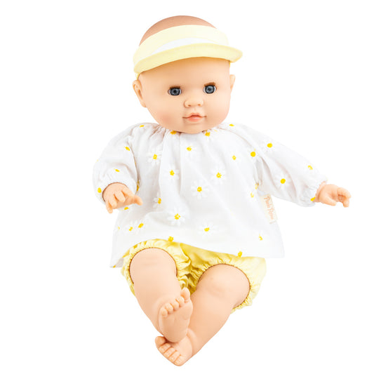 Tona ist eine Puppe mit blauen Augen, einem Sommeroutfit und heller Hautfarbe. Die Puppe ist für Kinder ab 10 Monaten geeignet.