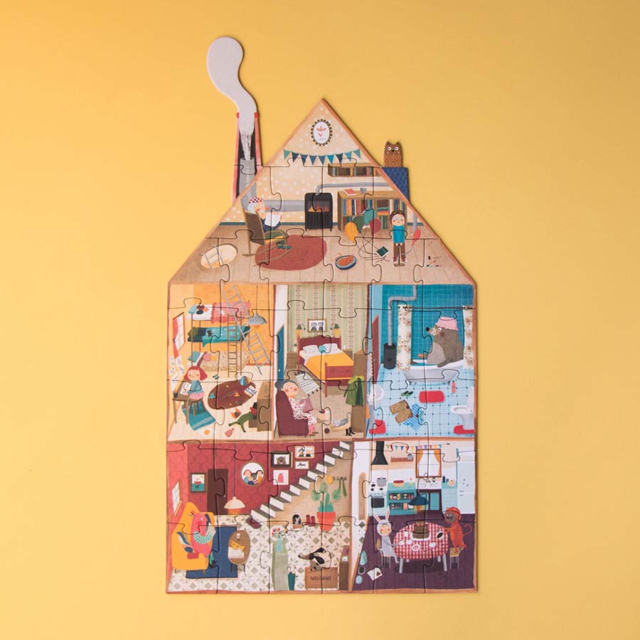 Das Puzzle von Londji zeigt auf der einen Seite die Räume des Hauses und seine Bewohner.