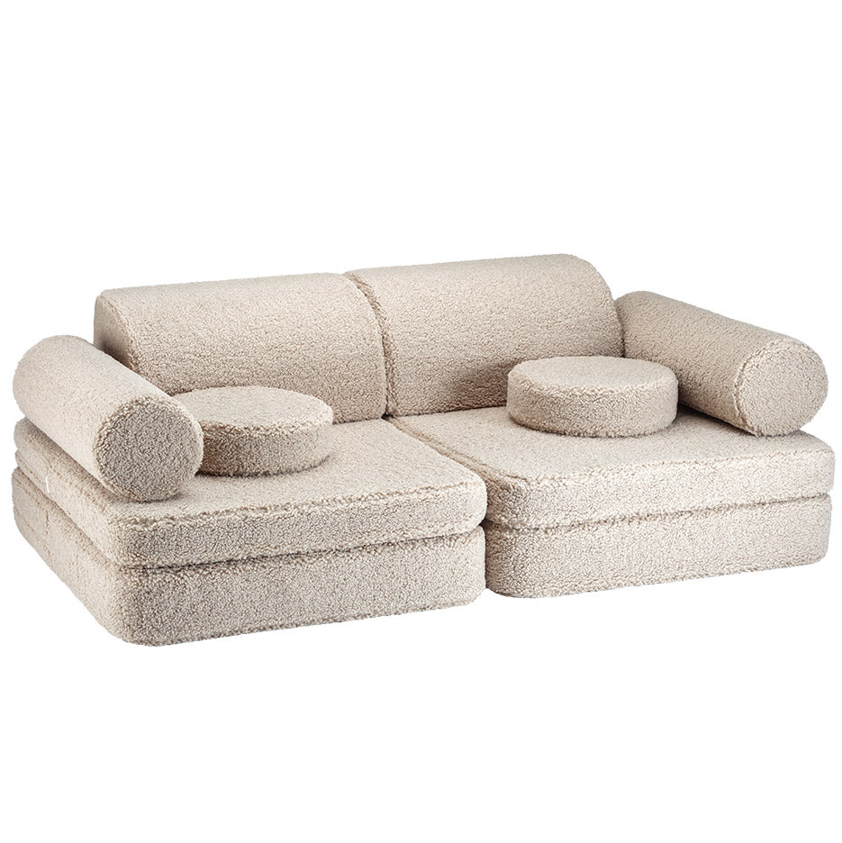 Hübsches Kindersofa aus Teddystoff in der Farbe beige. 9-teilig mit tollen Kissen.