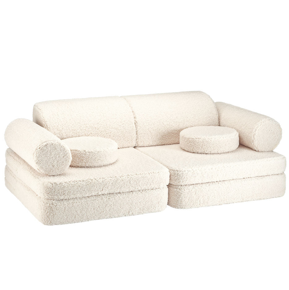 Hübsches Kindersofa aus Teddystoff in der Farbe creme. 9-teilig mit tollen Kissen.