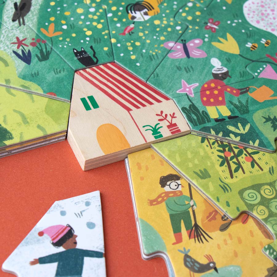 In der Mitte des Puzzles von Londji steht ein kleines Haus. Darum spielt sich das Leben in den Jahreszeiten ab. 